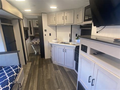 5 cubic ft of pass-thru storage) - Automotive grade painted aerodynamic front cap - MORryde Step Above exterior steps - Glow in the dark graphics Top Interior Features - All new master chef kitchen with new Infinity edge countertops and stainless undermount sink. . Mallard m251bh